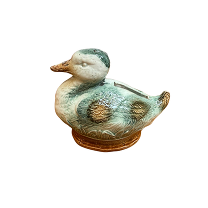 Petit canard tirelire à casser en barbotine (années 50/60)