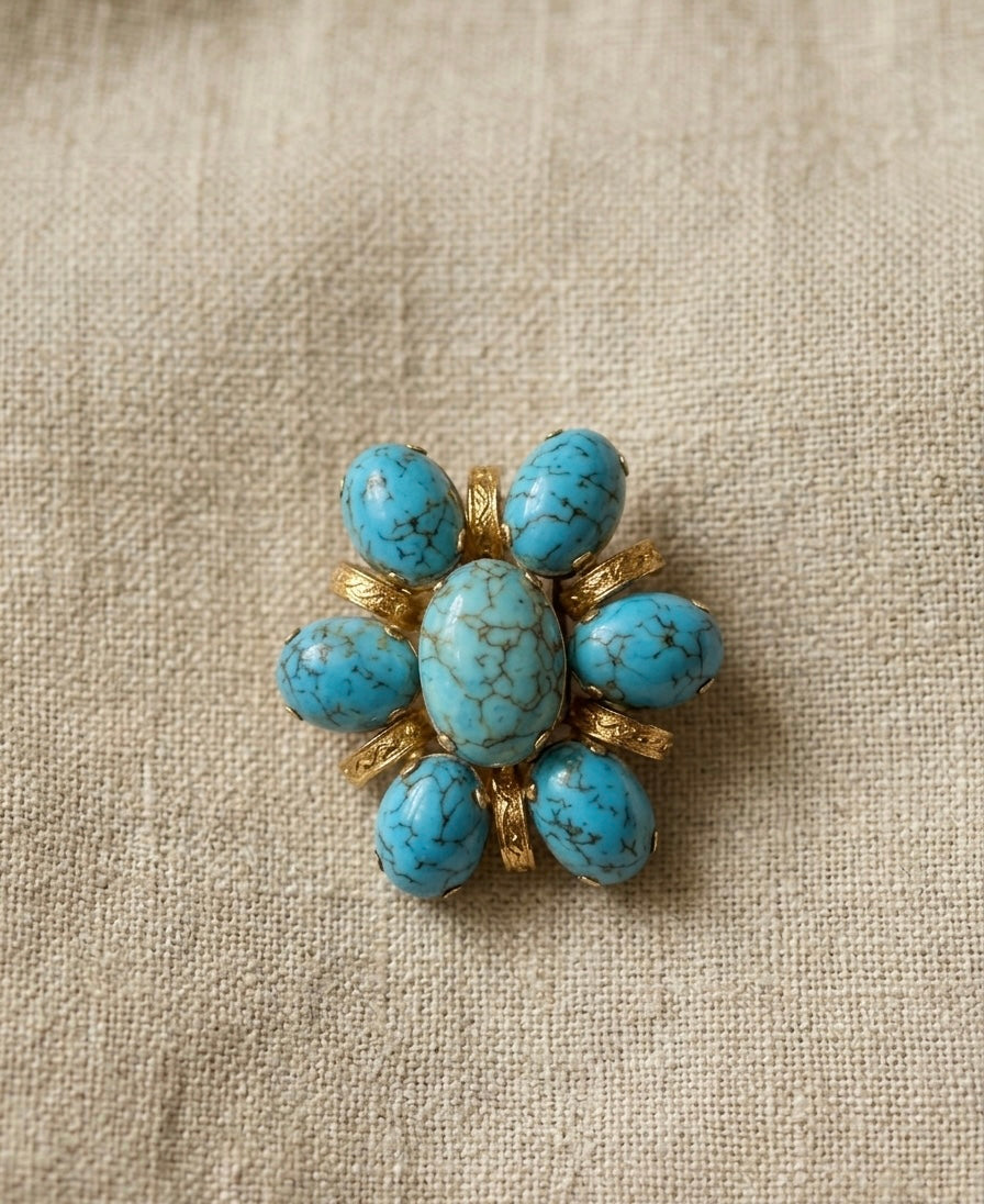 Broche fleur avec pierres bleues